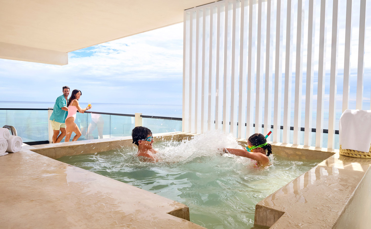 AVA Resort Cancun family in room with ocean view