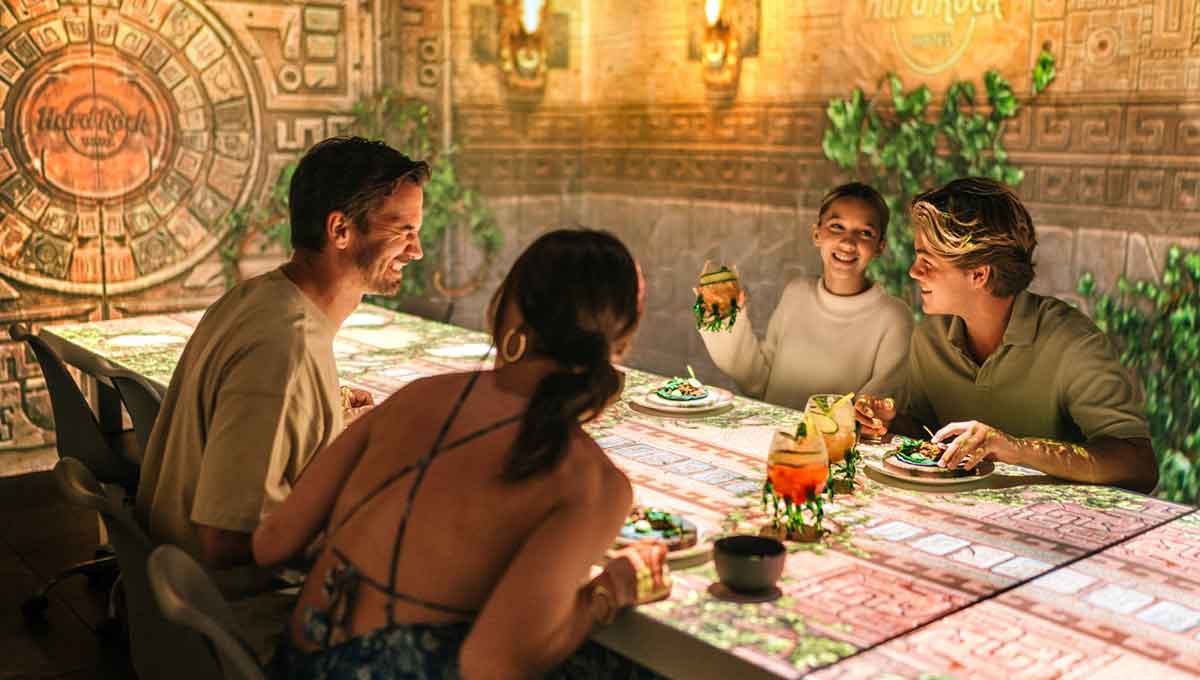 A family sitting and dinning with experience interactive