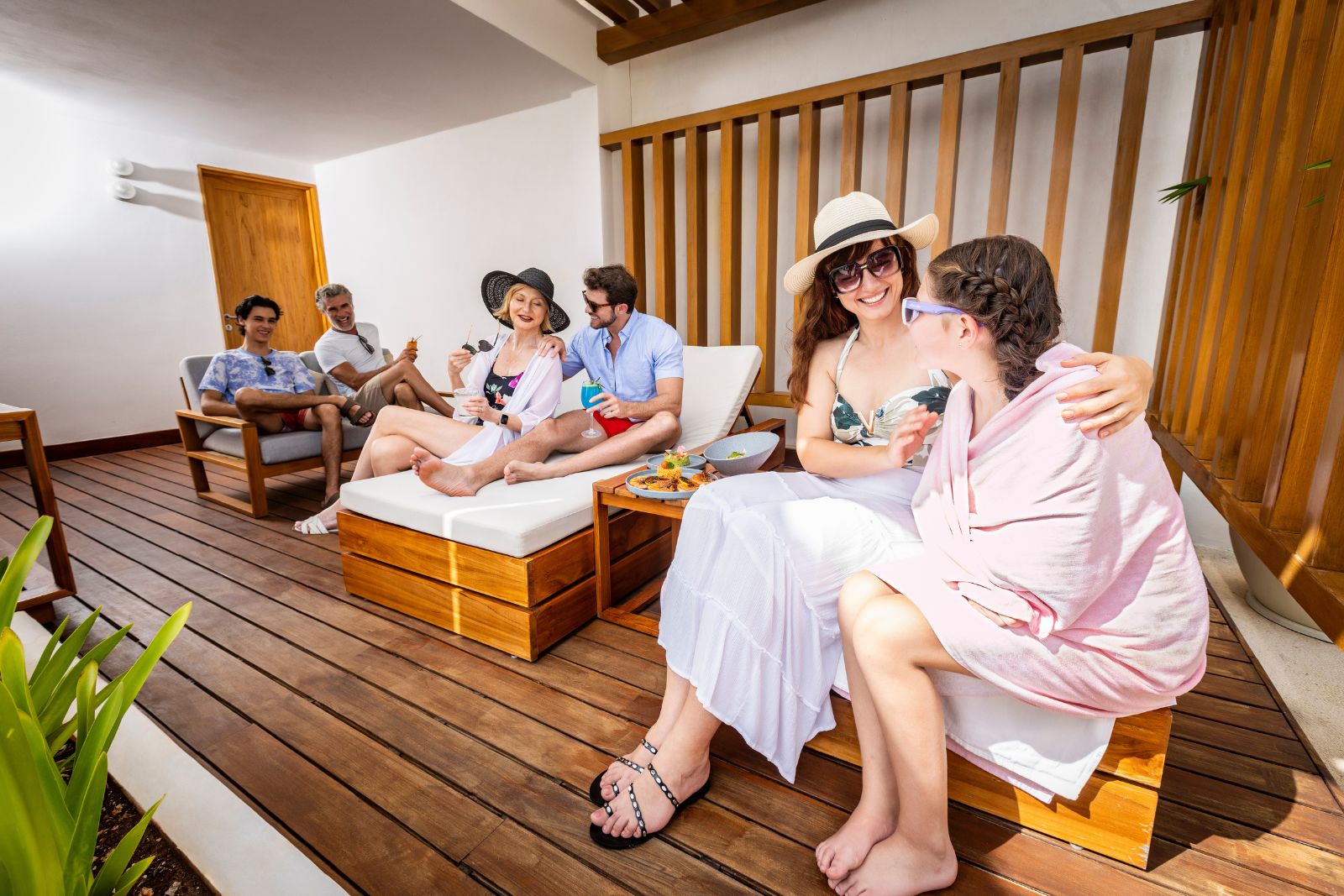 a group of people sitting on a deck